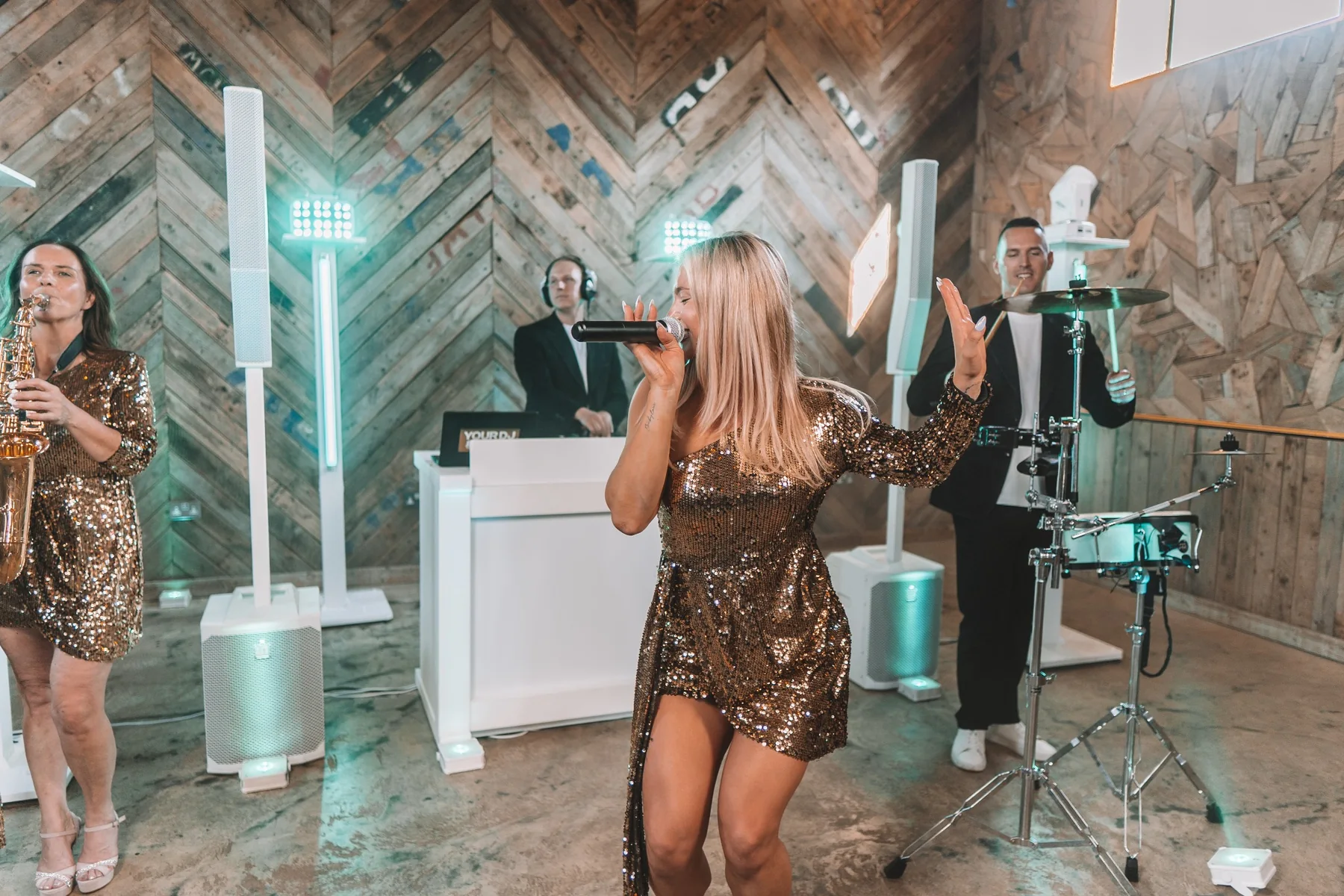 Singer performing with The Ibizans DJ live band